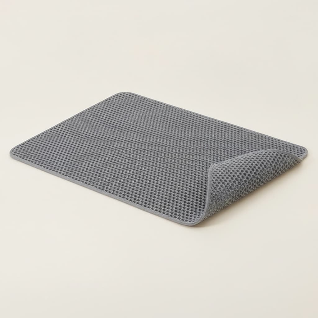 Two-layer trapping mat